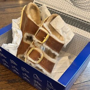 Birkenstock Tan Shearling Sandals with Gold Buckles